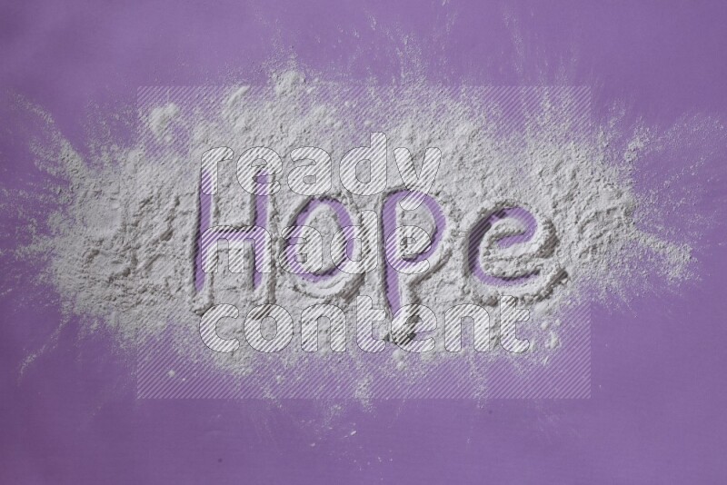 A word written with white powder on purple background