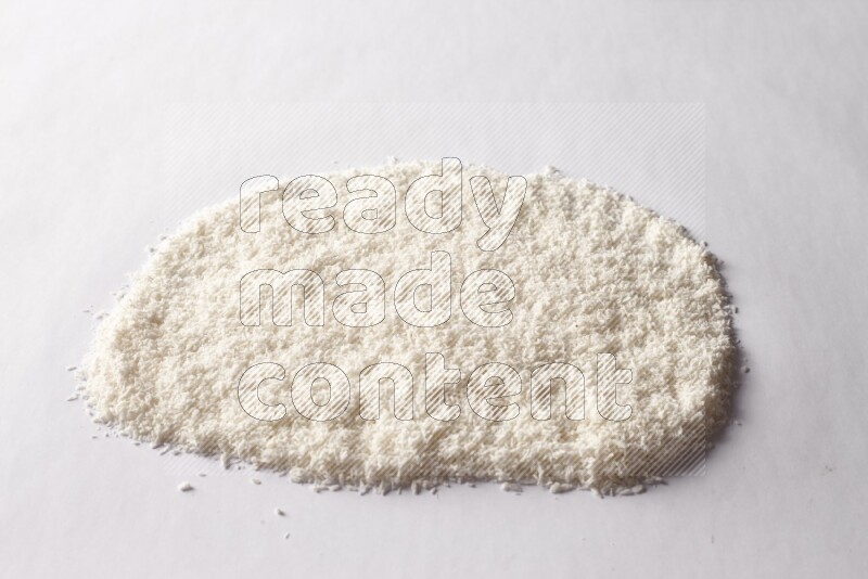 Desiccated coconuts on white background