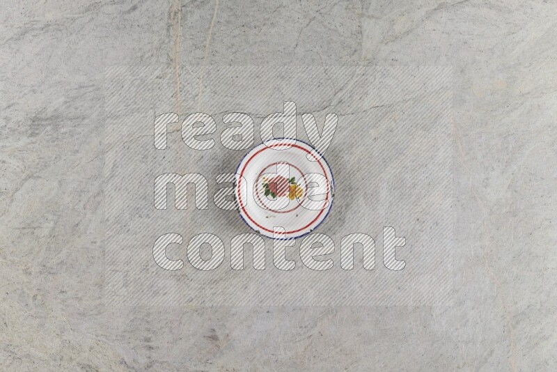 A vintage metal plate on grey marble background
