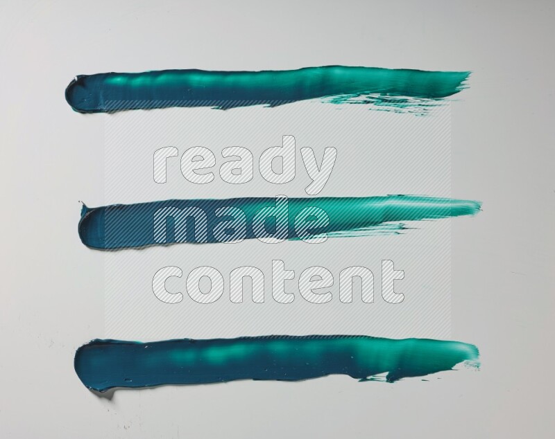Turquoise painting knife strokes on white background