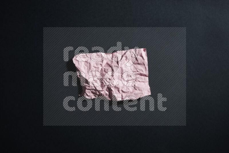 Pink paper sheet on black background