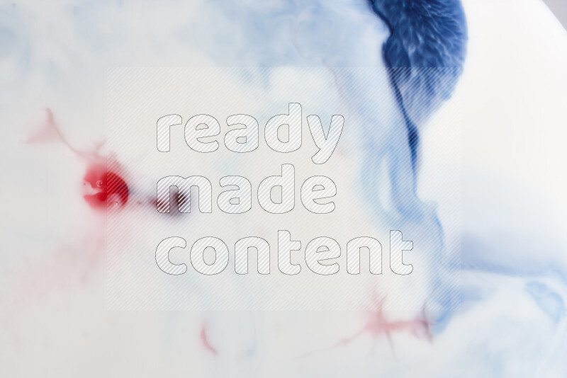 A close-up of abstract swirling patterns in blue, red and white