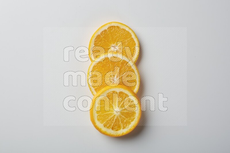 Three orange slices on a white background