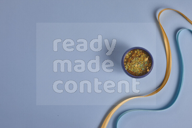 A yellow and blue collection of sewing and tailoring tools arranged on a blue background