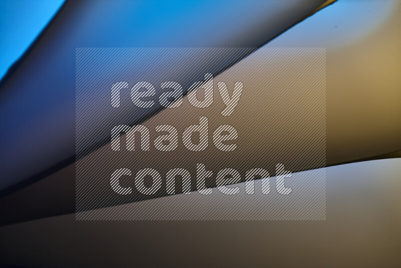 An abstract art piece displaying smooth curves in warm and cold gradients created by colored light