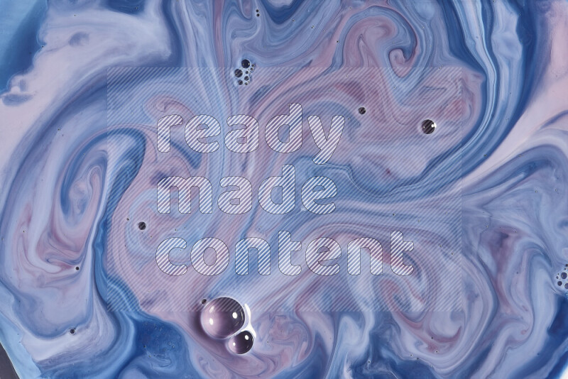 A close-up of abstract swirling patterns in blue, red and white