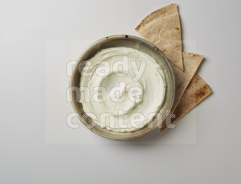 Plain Lebnah  in a grey pottery plate on a white background