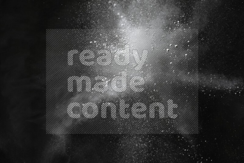 White powder explosion on black background