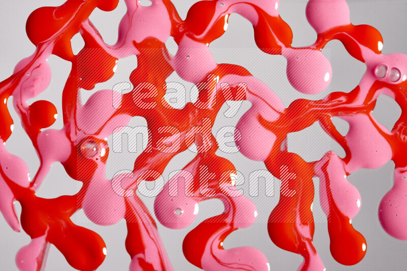 خلفية ملونة مع مزيج من ألوان الطلاء الوردي والأحمر