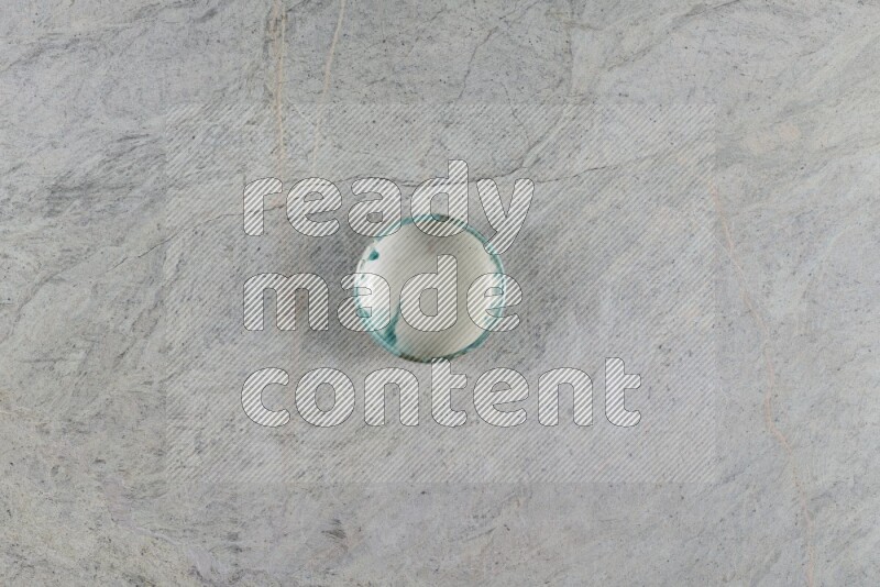 A multicolored pottery Bowl on grey marble background