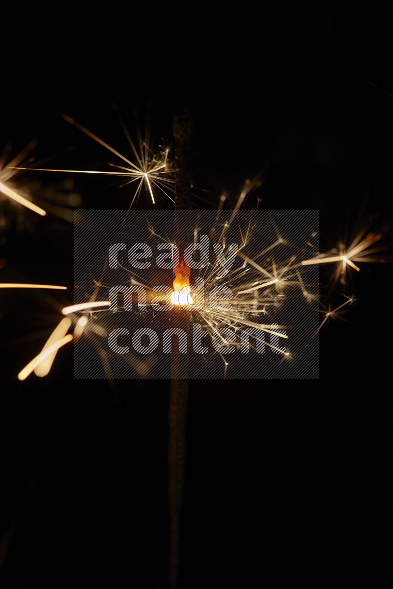 A close-up image of sparkler candle isolated on black background