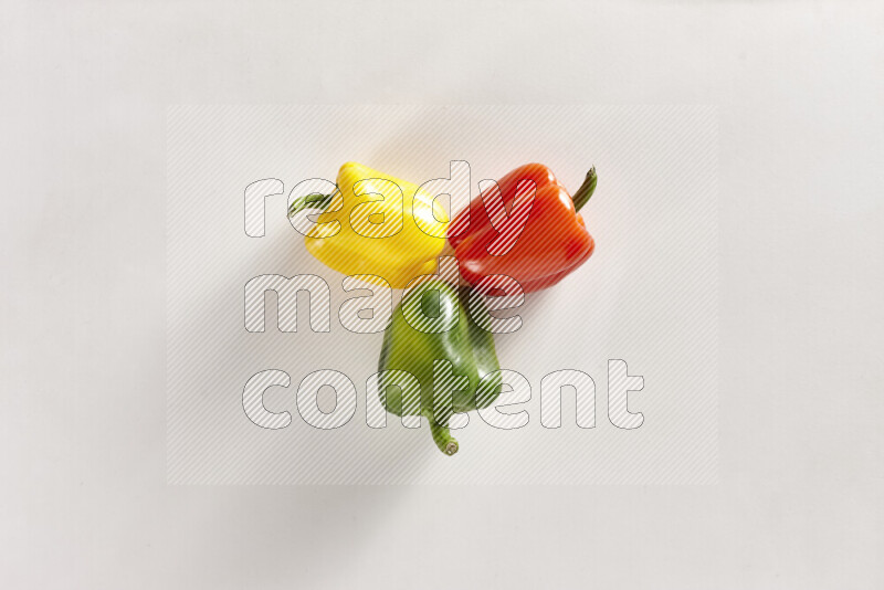 Assorted bell peppers on white background