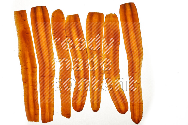 Carrots slices on illuminated white background