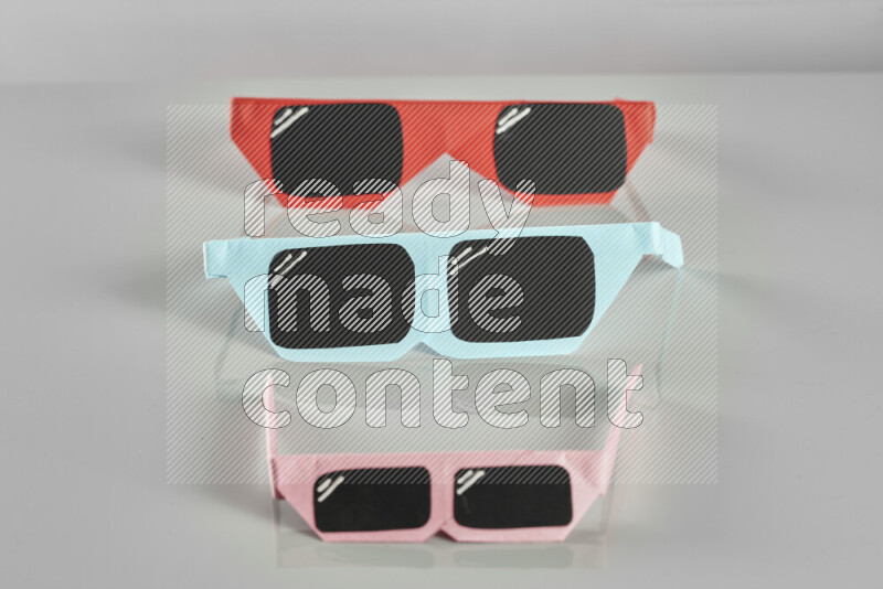 Origami sun glasses on grey background