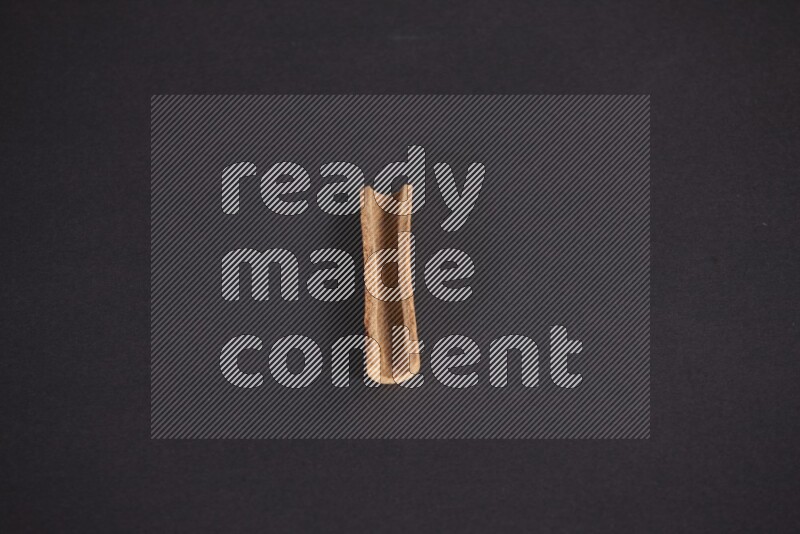 Cinnamon stick on black background
