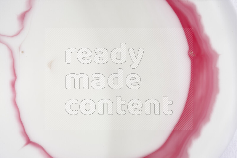 A close-up of abstract swirling patterns in red and white