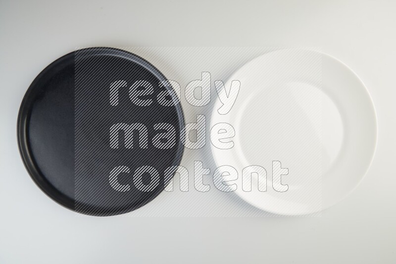 white and black plates on white background