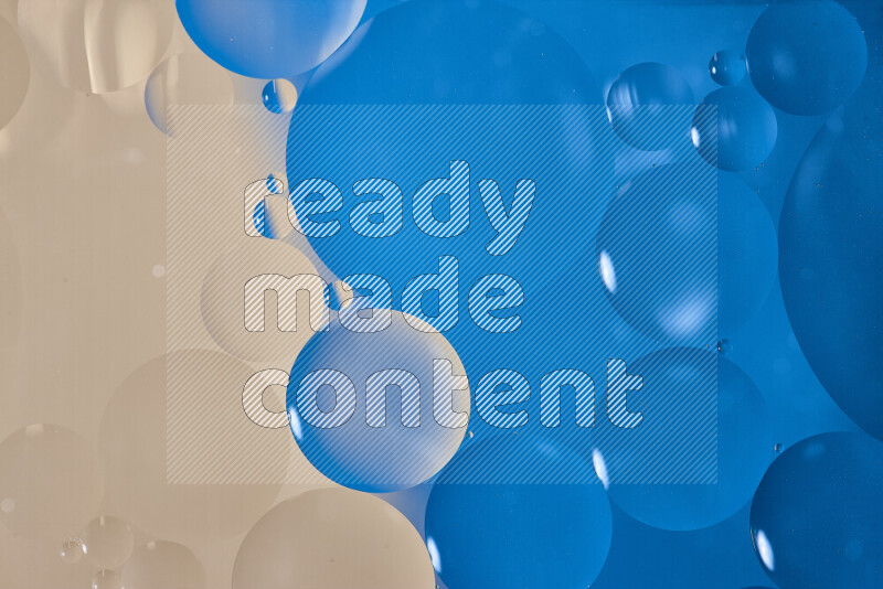 Close-ups of abstract oil bubbles on water surface in shades of blue and brown