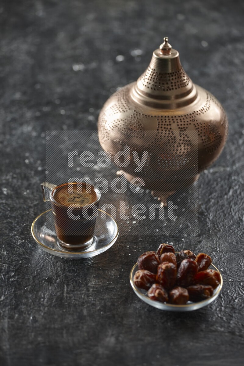 A golden lantern with different drinks, dates, nuts, prayer beads and quran on textured black background