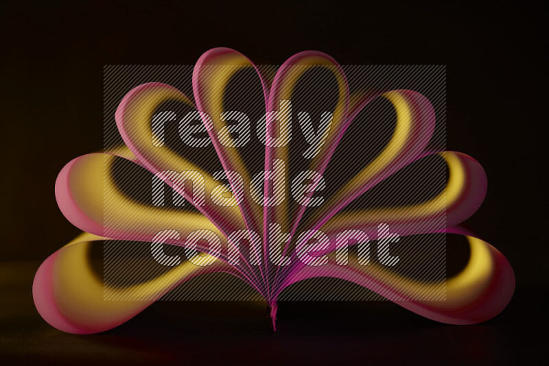 An abstract art piece displaying smooth curves in yellow and pink gradients created by colored light