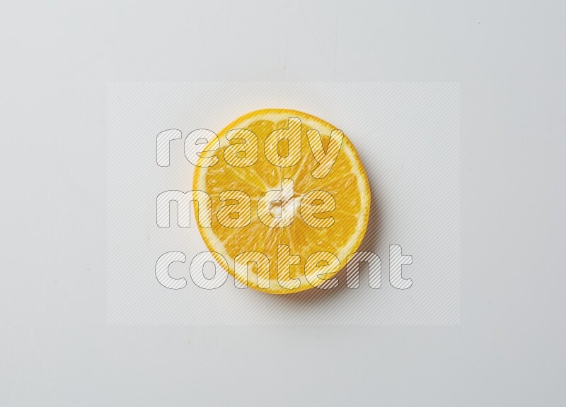 A Single orange slice on white background