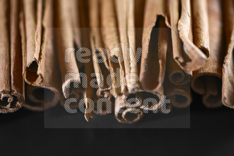 Cinnamon sticks on black background