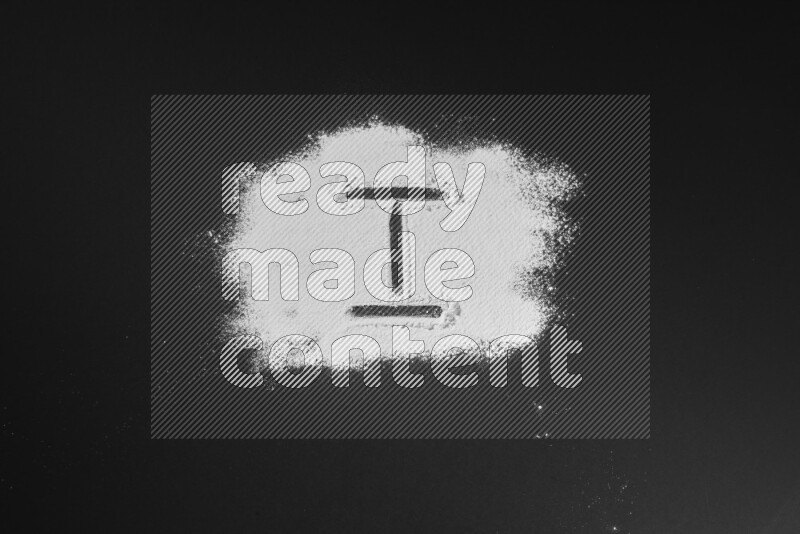 Alphabets written with powder on black background