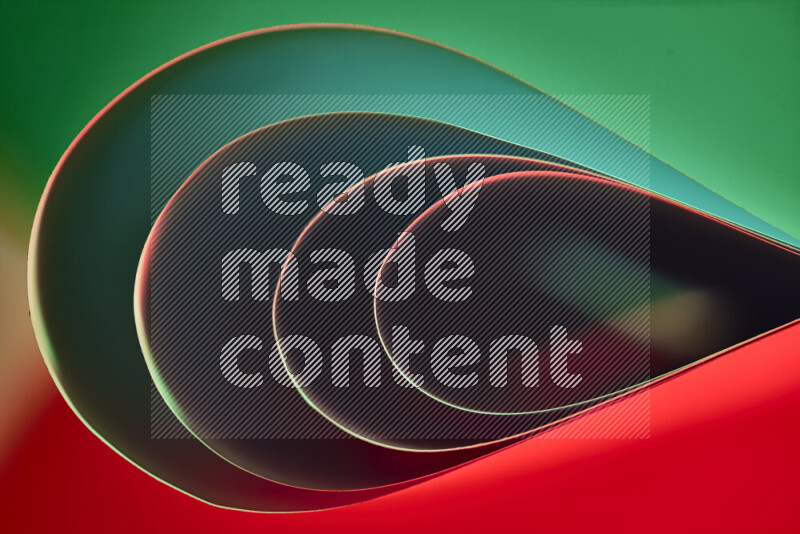 An abstract art of paper folded into smooth curves in green and red gradients