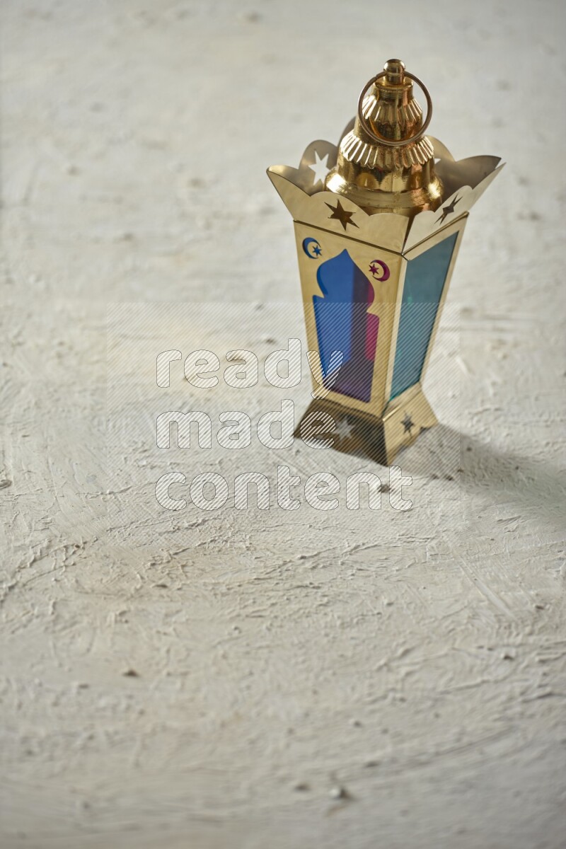 A lantern placed on a textured white background