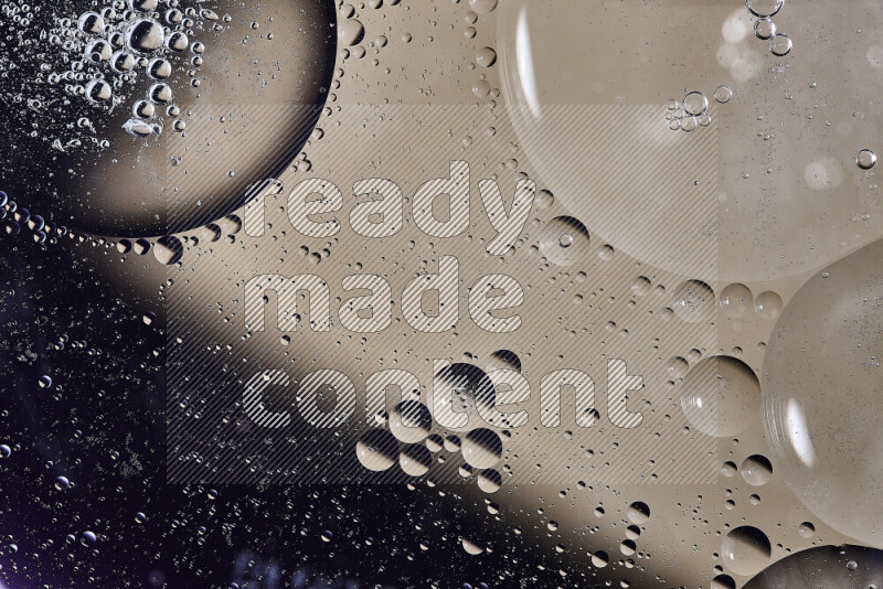 Close-ups of abstract oil bubbles on water surface in shades of purple and brown