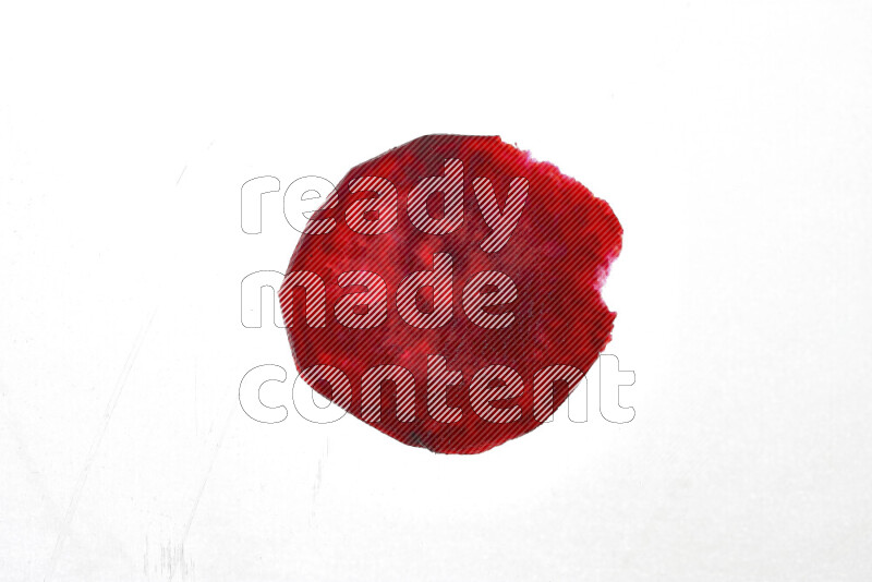 Beet slices on illuminated white background