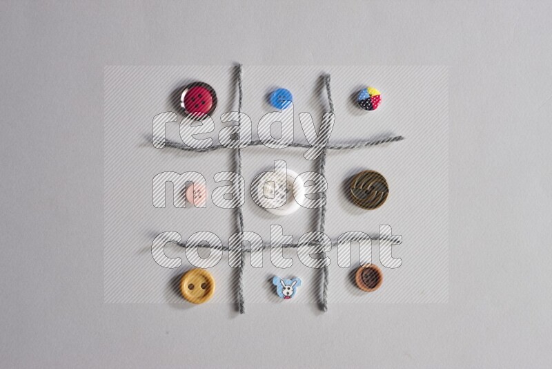 Multicolored buttons placed on grey background