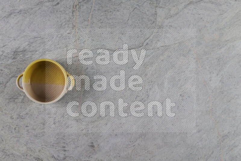 A multicolored pottery Bowl on grey marble background