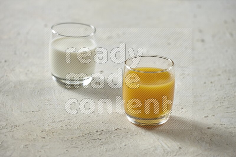 Cold drinks in a glass cup such as water, tamarind, qamar eldin, sobia, milk and hibiscus on textured white background