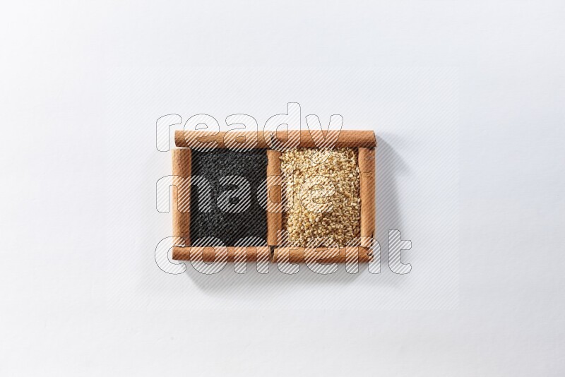 2 squares of cinnamon sticks full of sesame and black seeds on white flooring