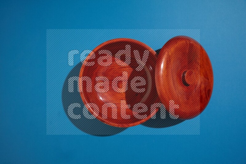 brown bowl on blue background