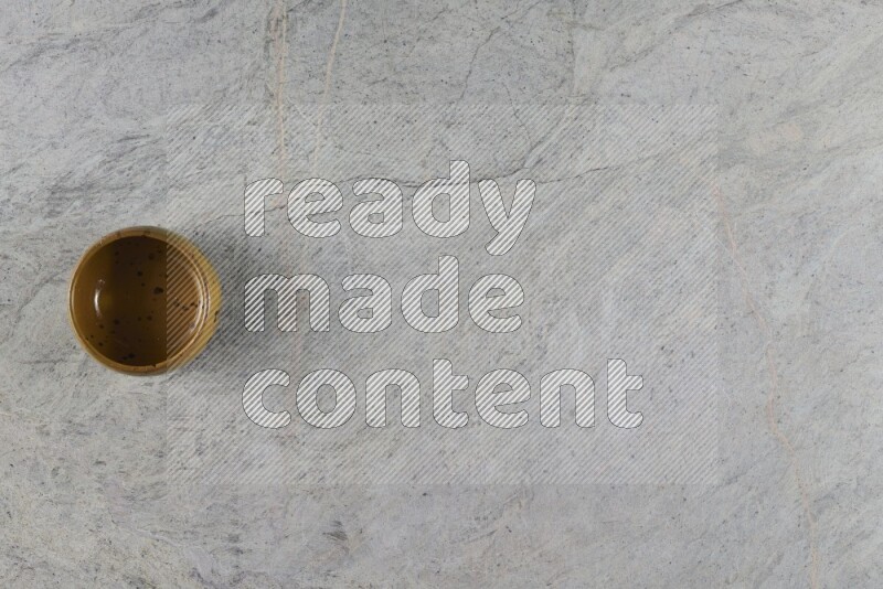 A multicolored pottery Bowl on grey marble background