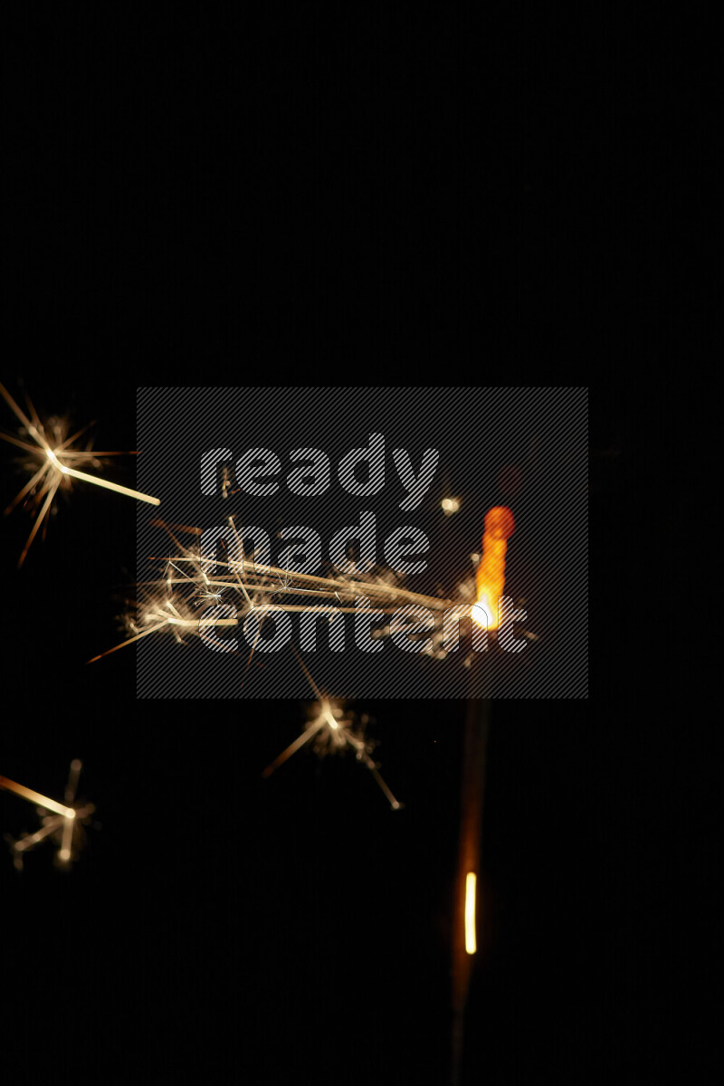A close-up image of sparkler candle isolated on black background