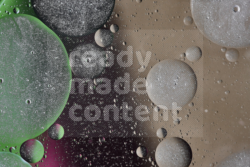 Close-ups of abstract oil bubbles on water surface in shades of brown, black, green and pink