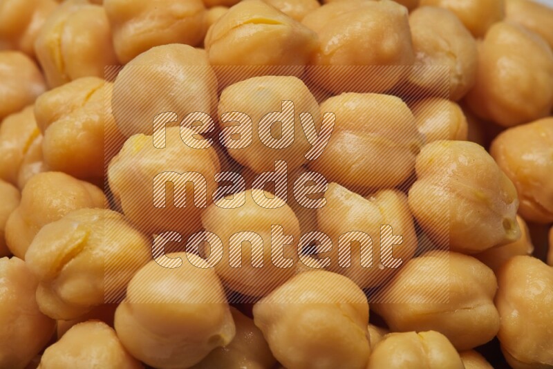 Close up shot of boiled chickpeas on white background