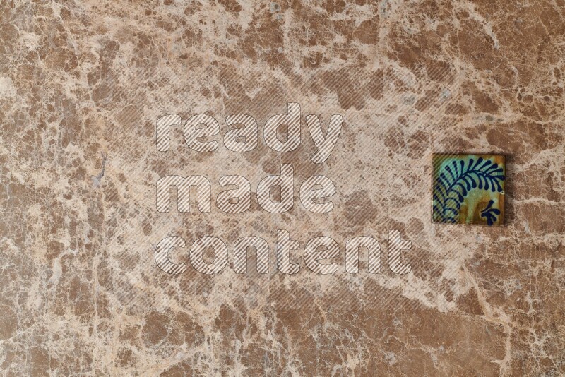 A decorative coaster on beige marble background