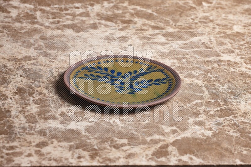 Decorative Pottery Plate on Beige Marble Flooring