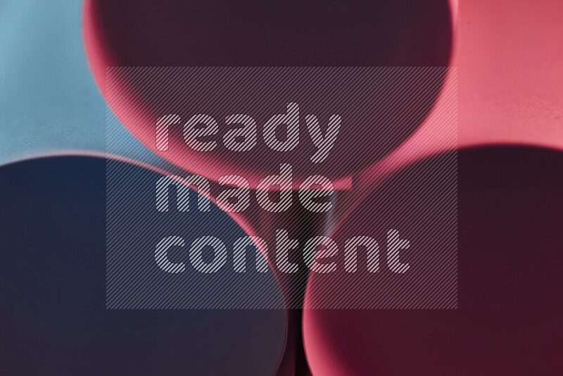 The image shows an abstract paper art with circular shapes in varying shades of blue and red