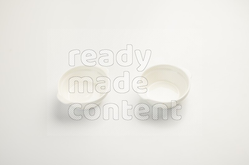 white ceramic round sauce dish on white countertop