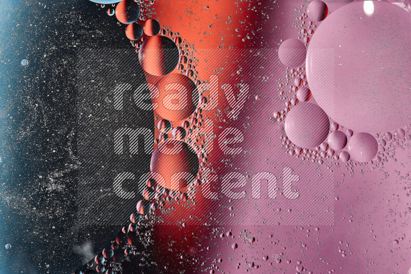 Close-ups of abstract oil bubbles on water surface in shades of blue, red and purple