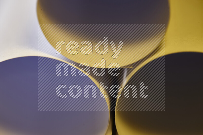 The image shows an abstract paper art with circular shapes in varying shades of grey and warm tones