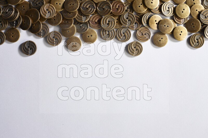 Metal buttons placed on grey background