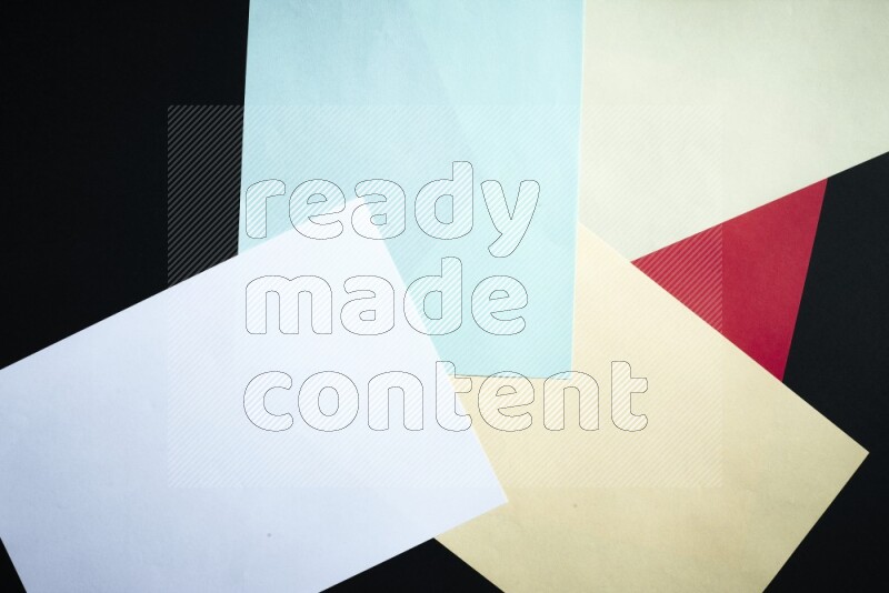 Multicolored paper sheet on black background