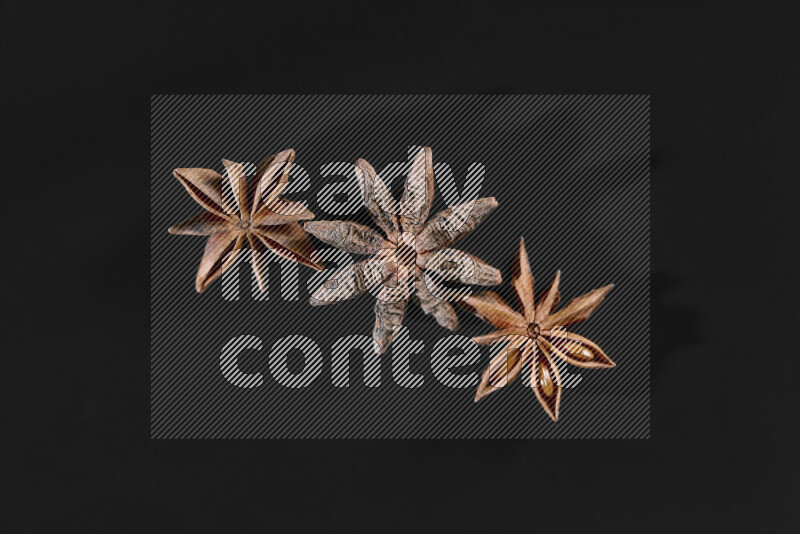 Star anise on black background