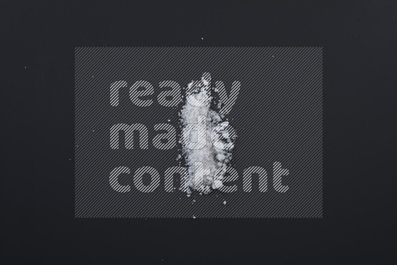 Bunches of table salt, coarse sea salt, fine himalayan salt and coarse himalayan salt on black background